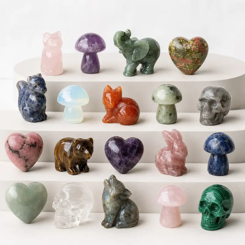 Assorted realistic crystal carvings on a clean display