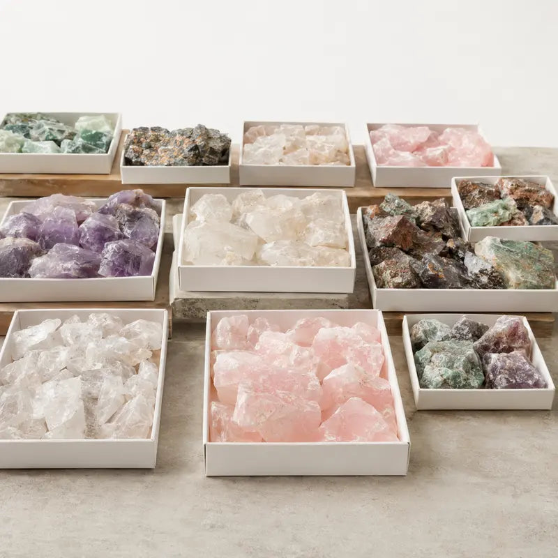 Natural rough crystals and mineral specimens arranged in wholesale trays